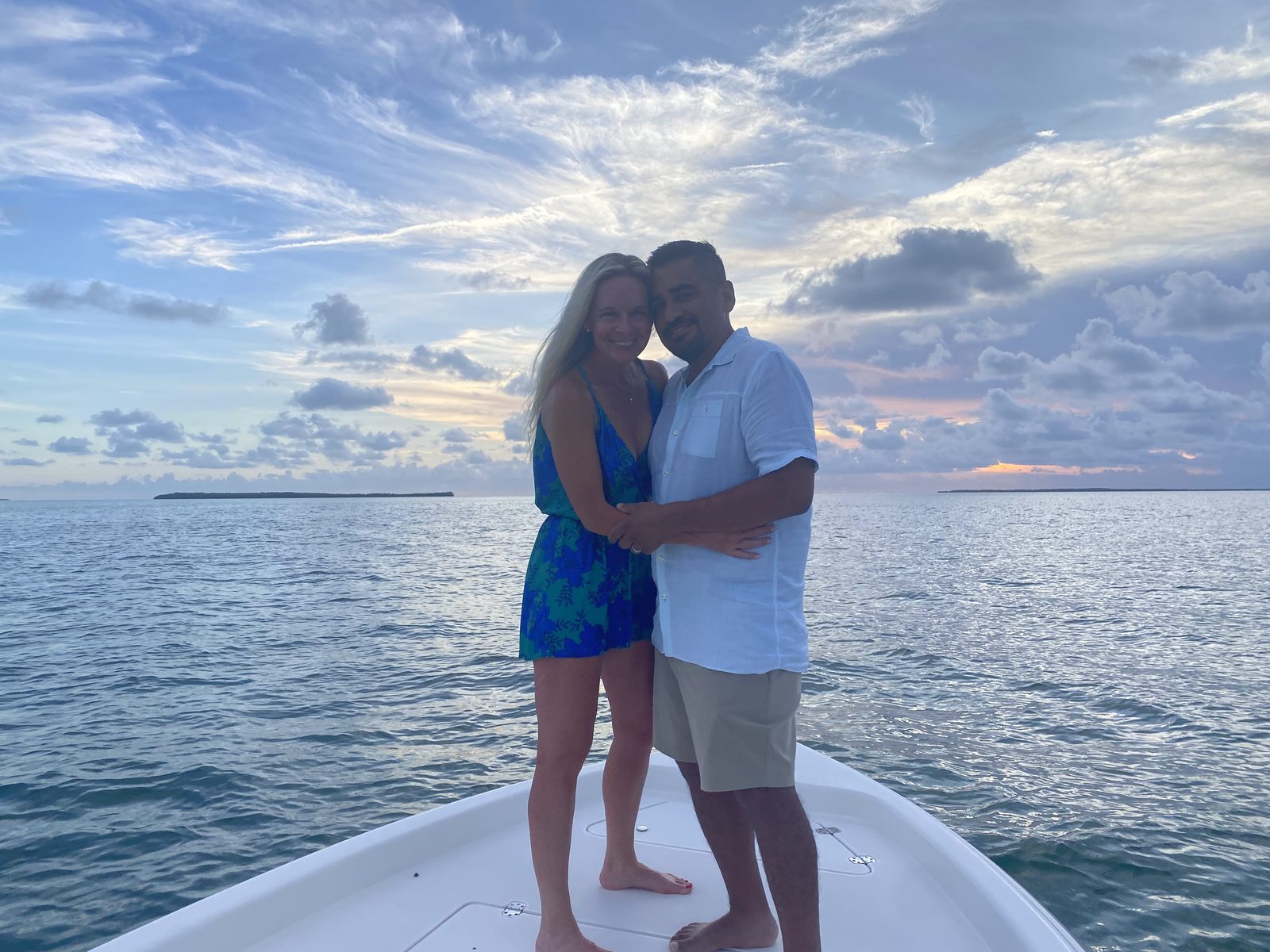 Couple on the bow at sunset over Florida Bay