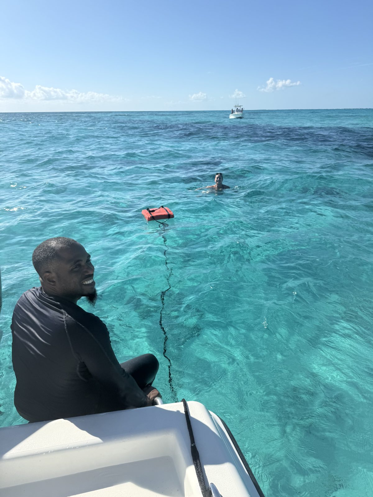 Snorkeler floating in shallow crystal-clear reef water